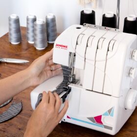 Janome MOD-8933 Serger Overlock Machine with Lay-In Threading, Adjustable Differential Feed, and Color-Coded Loops for 3 or 4 Thread Stitches